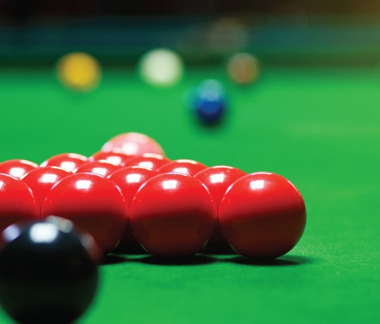 Close up of red balls on a snooker table